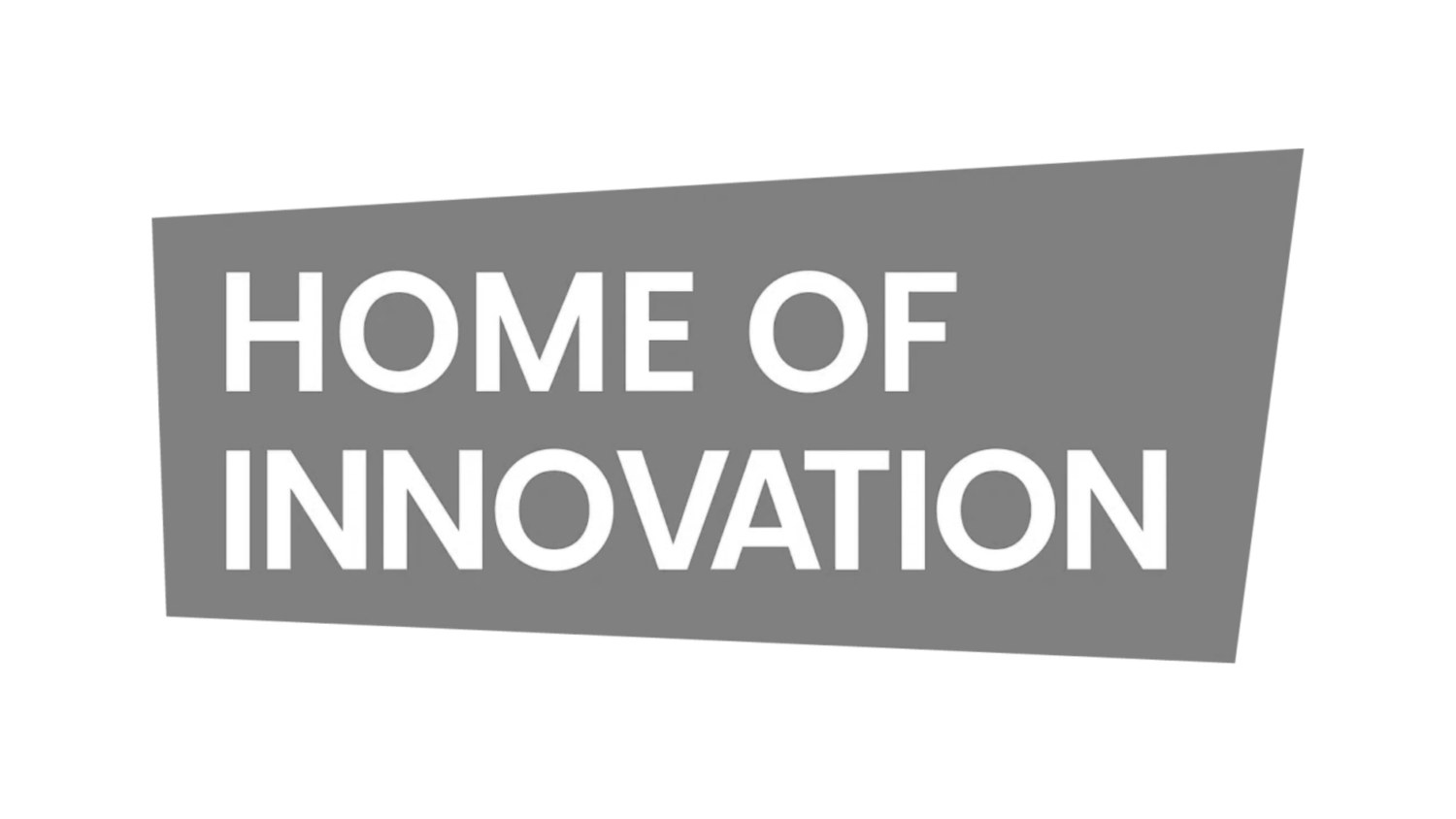 Gray parallelogram logo with bold white text reading Home of Innovation.