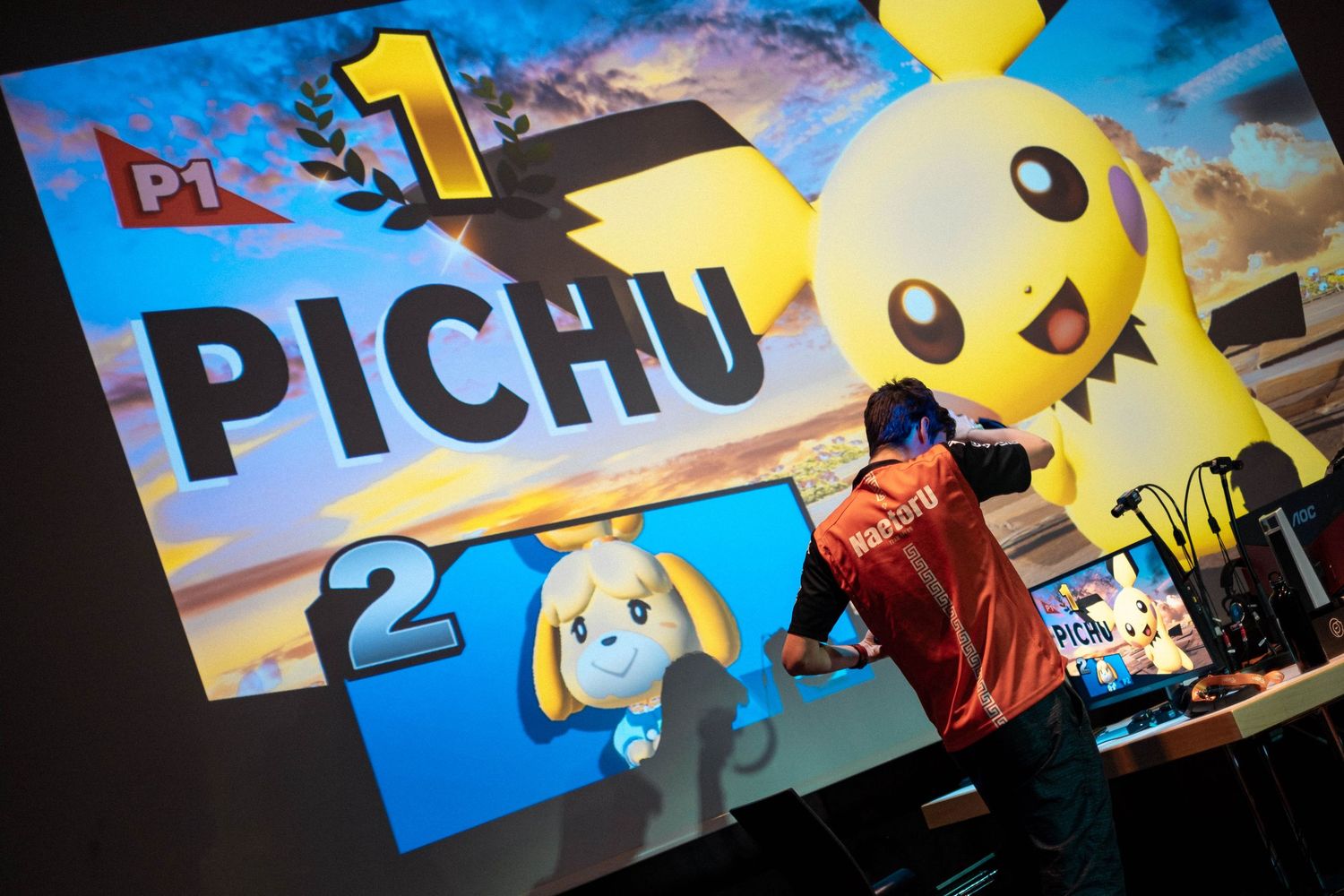 Naetoru wins against Jaka in a Super Smash Bros. tournament at Game Hotel, with Pichu displayed on the large screen.