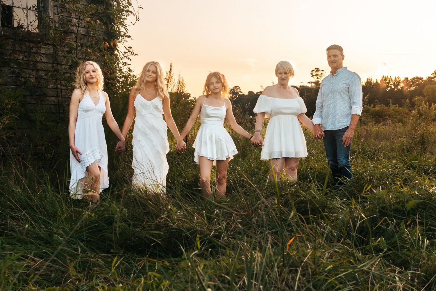 Family portrait outdoors at sunset