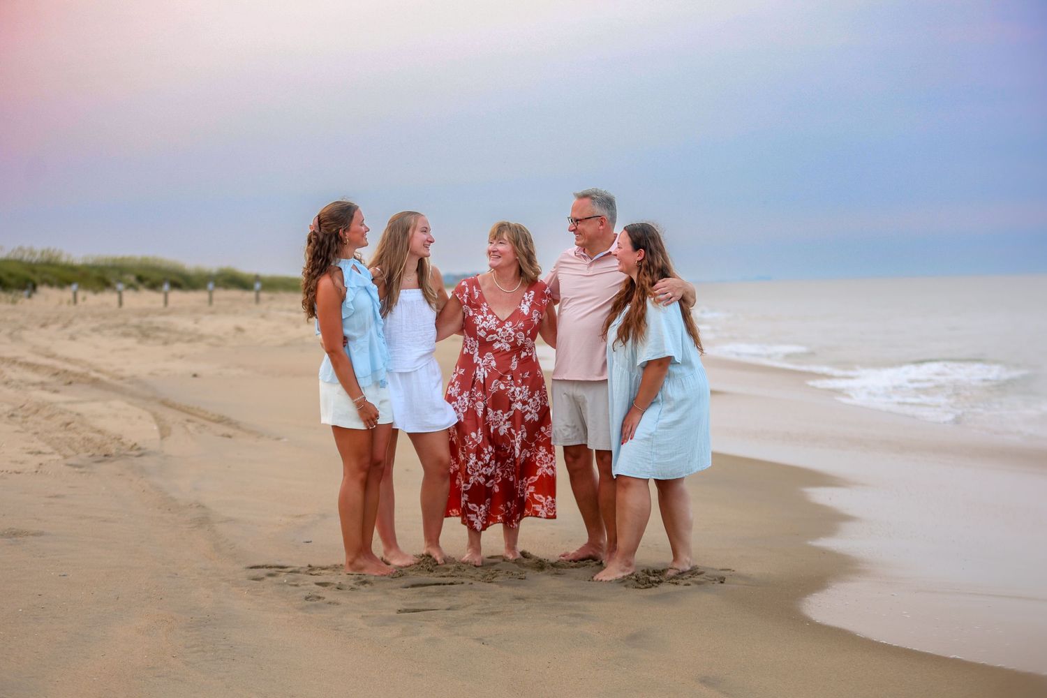 Family portrait on the beach at sunset