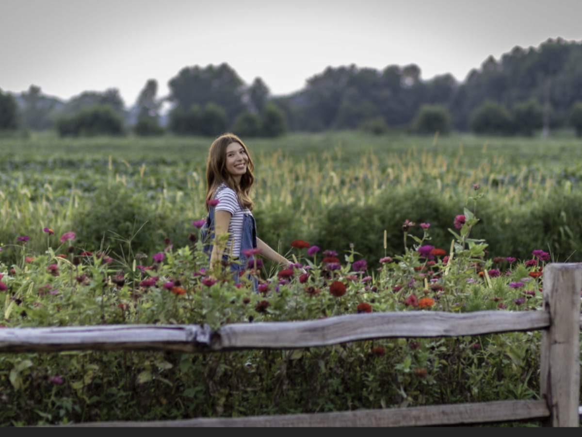 Senior portrait in a wildflower field