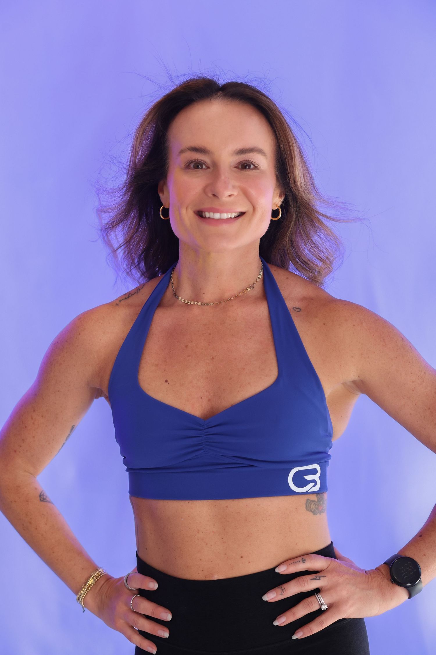 Fitness branding headshot of a woman in athletic wear