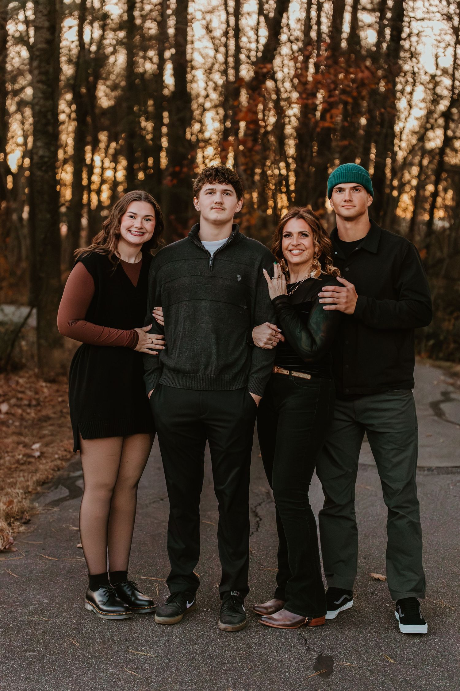 Family portrait of four people dressed in black outdoors