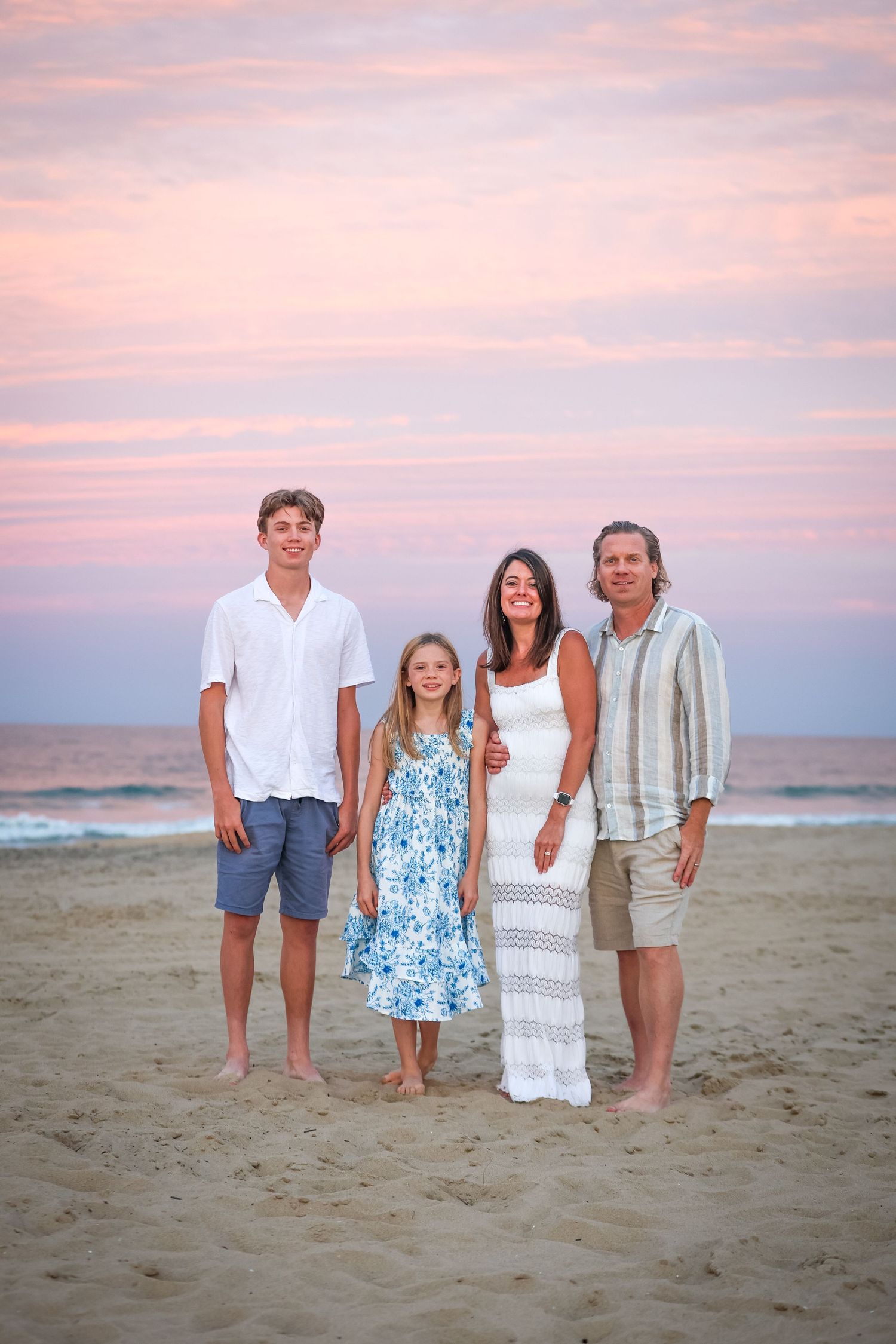 Family portrait on the beach at sunset in Virginia Beach