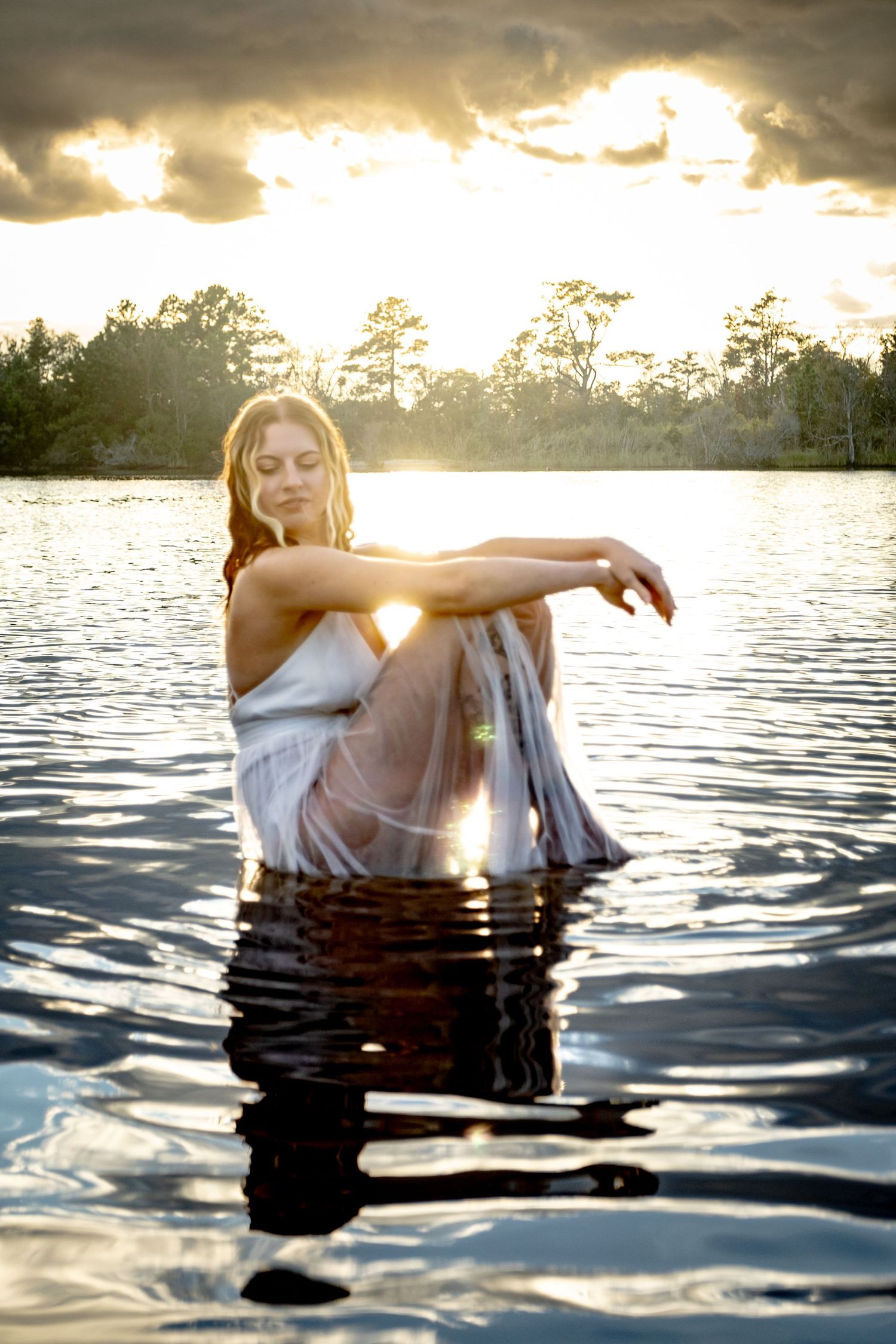 Creative portrait session in the water at sunset in Virginia Beach