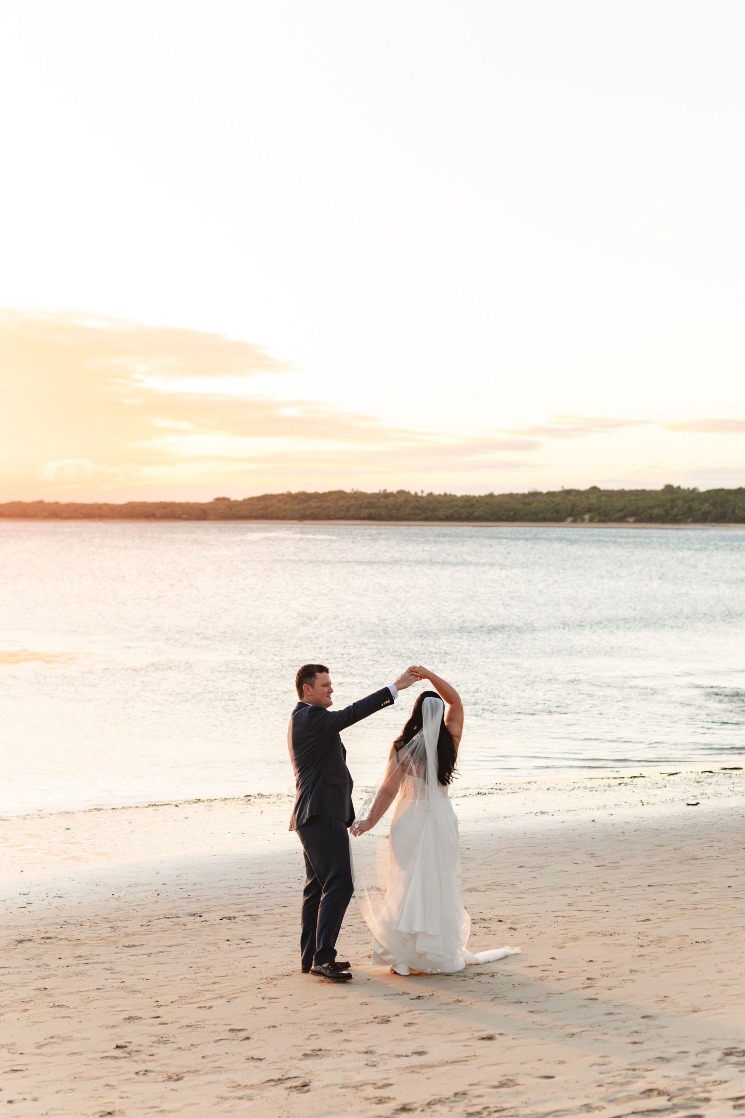 Fiji destination wedding photography capturing a couple celebrating by the ocean