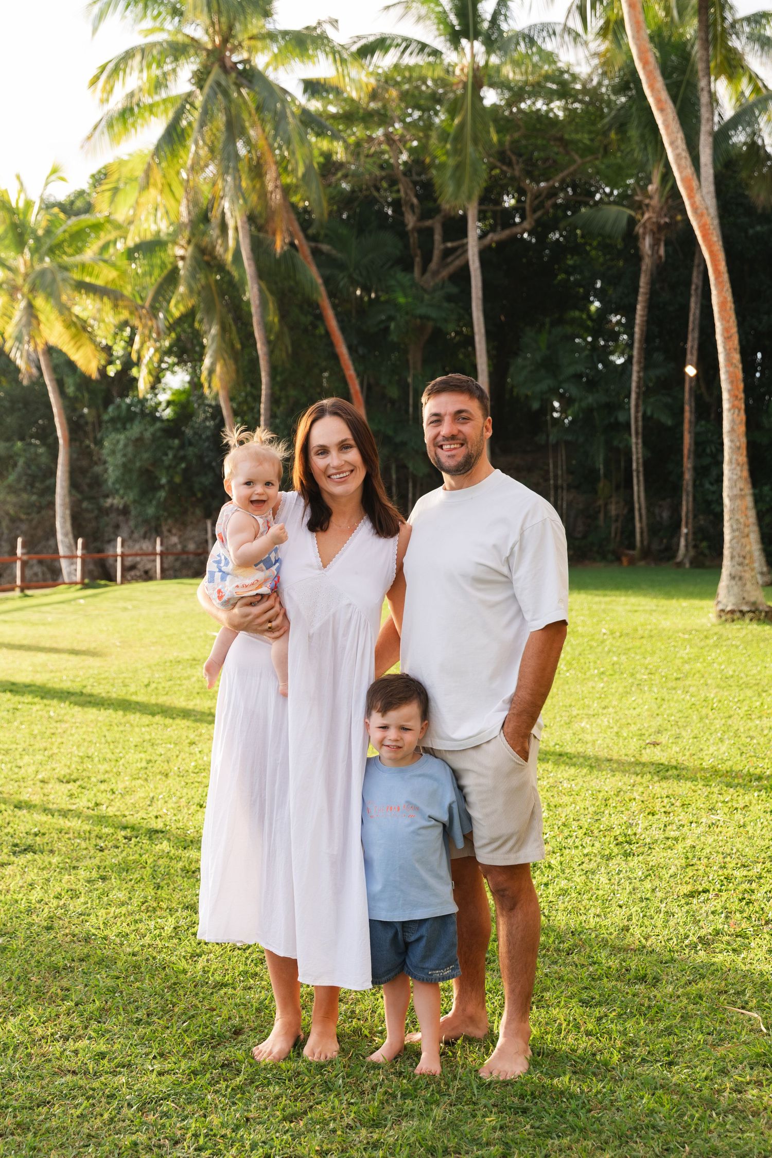 Happy family enjoying a Fiji beach photography session in Fiji