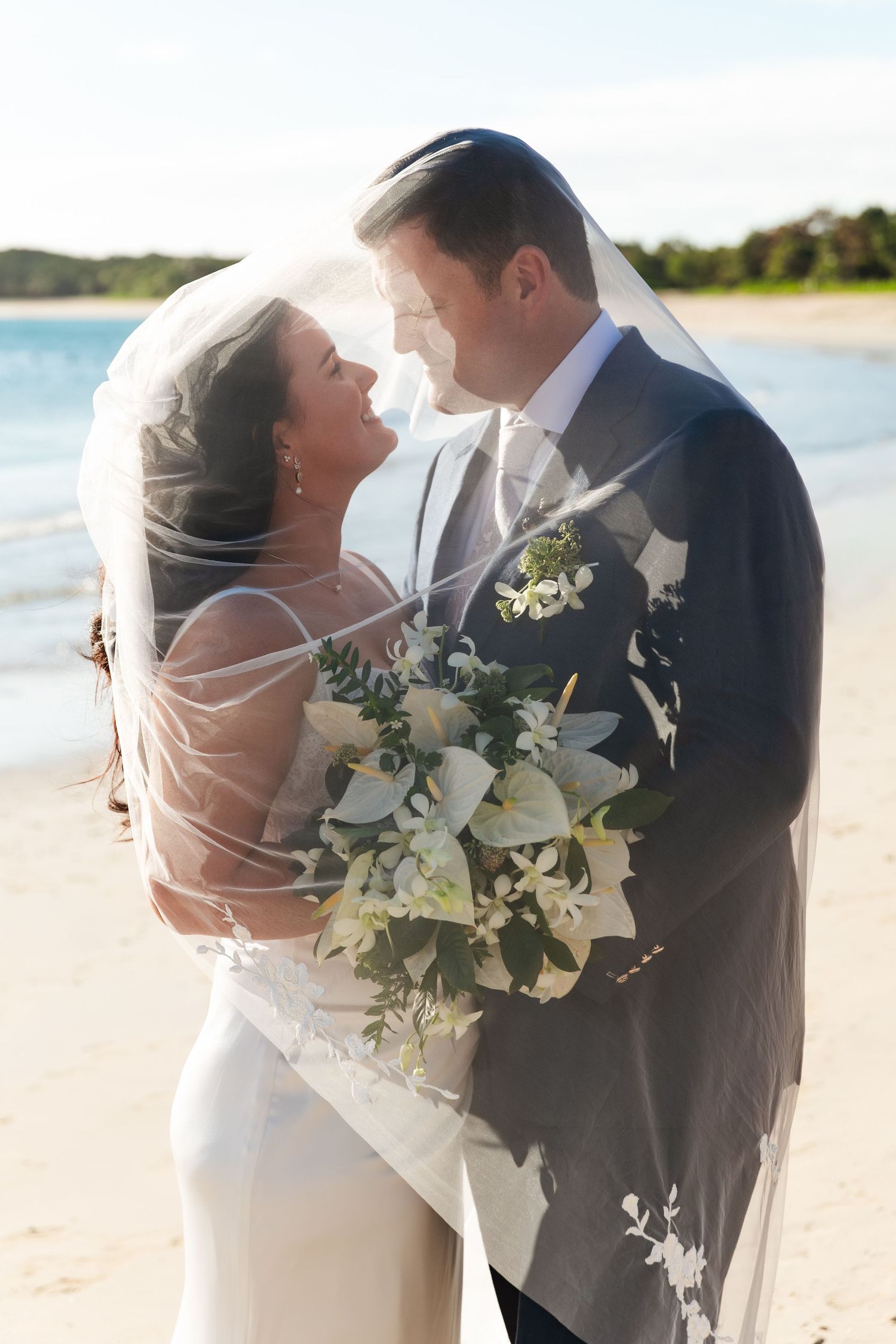Fiji destination wedding photography capturing a couple celebrating by the ocean