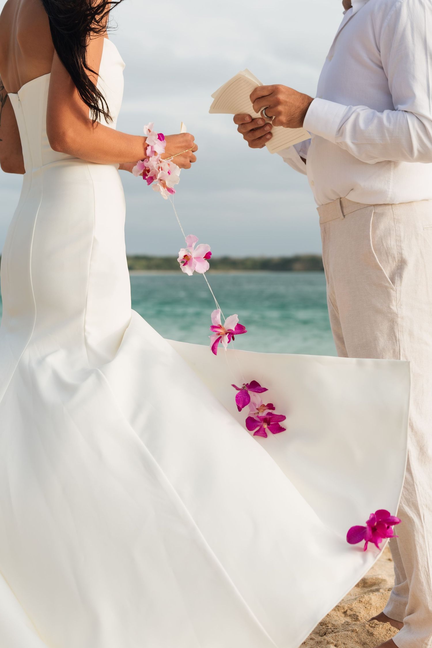 Fiji beach elopement with a couple celebrating their wedding by the ocean