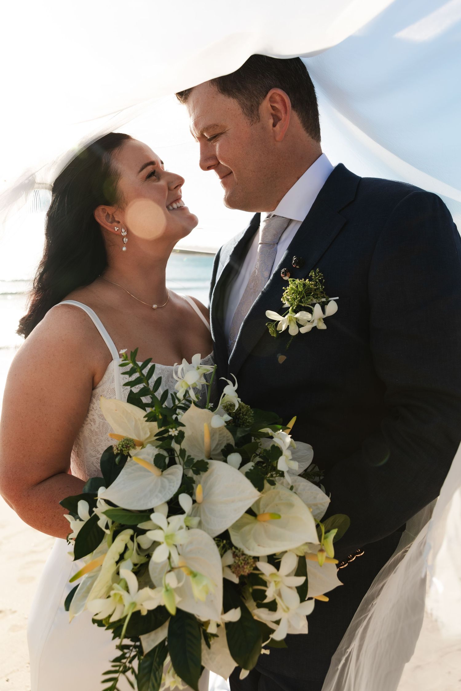 Fiji destination wedding photography capturing a couple celebrating by the ocean