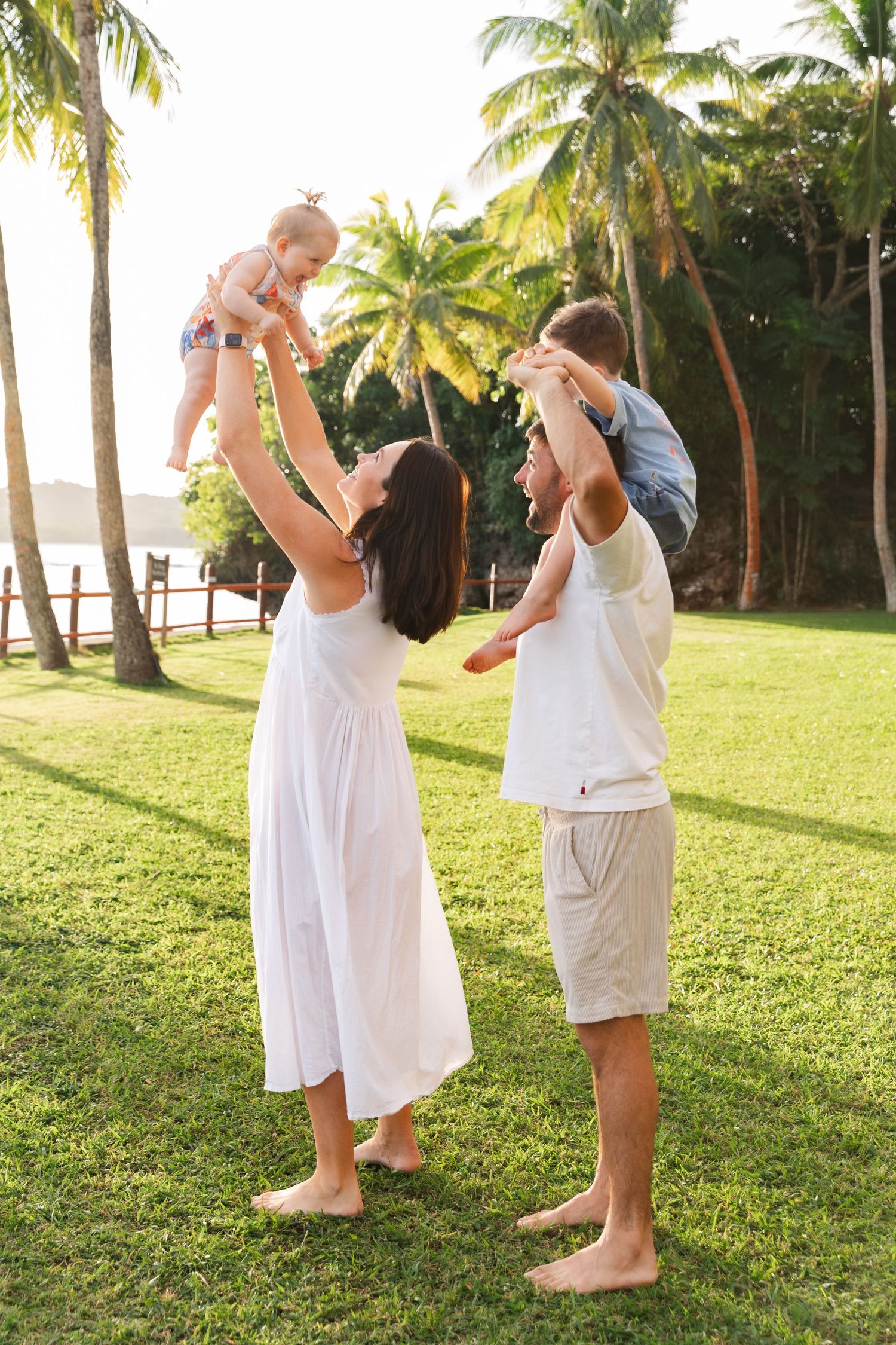 Happy family enjoying a Fiji beach photography session in Fiji