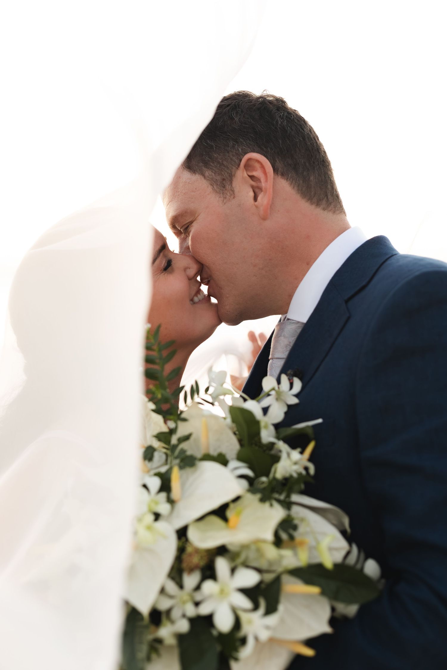 Fiji destination wedding photography capturing a couple celebrating by the ocean