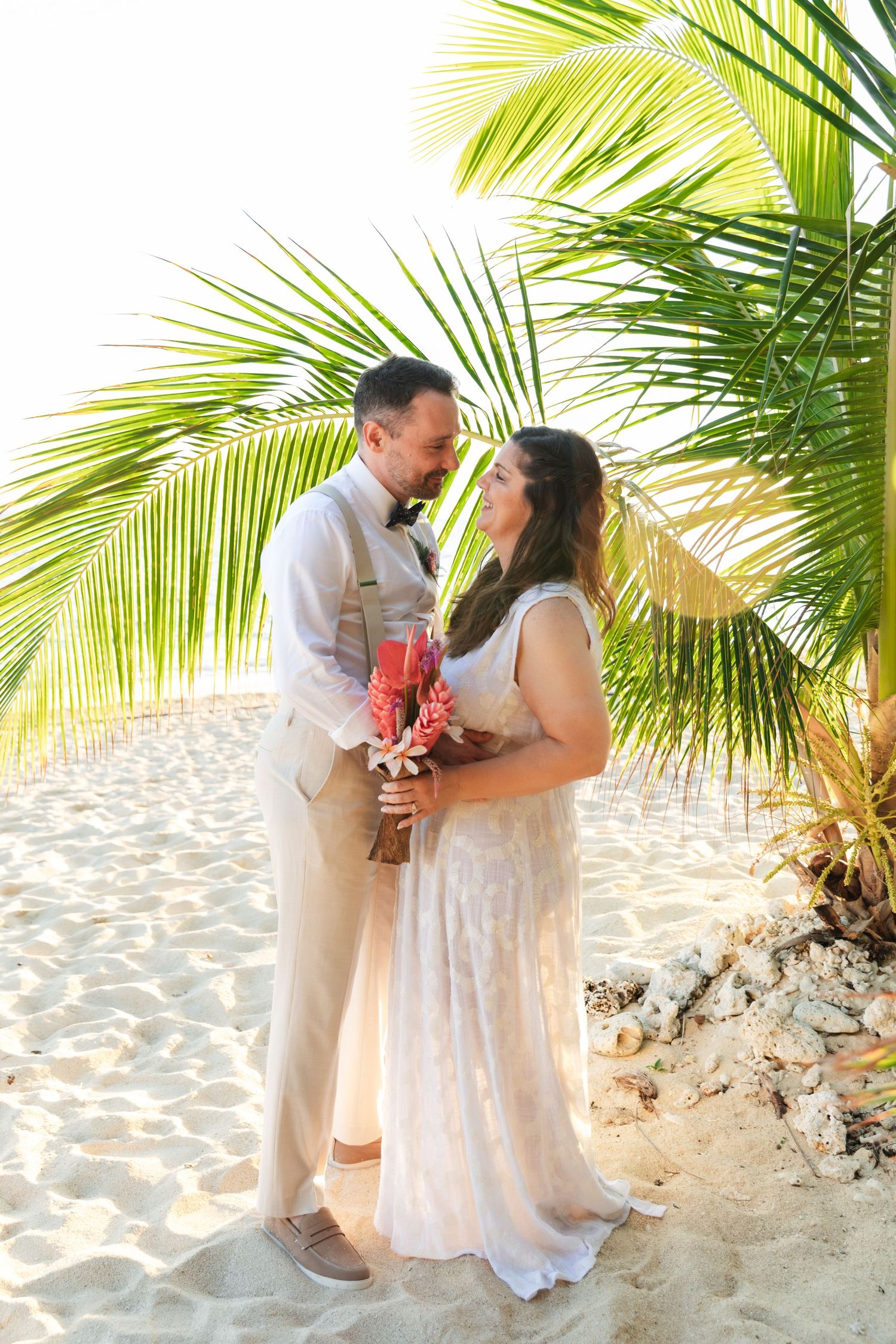 Fiji destination wedding photography capturing a couple celebrating by the ocean
