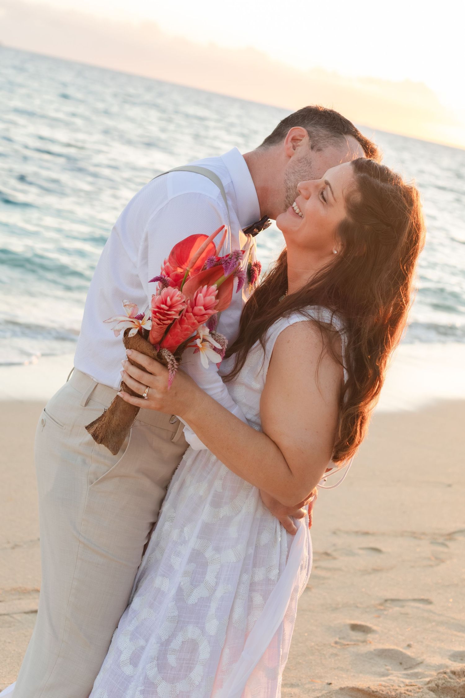Fiji destination wedding photography capturing a couple celebrating by the ocean