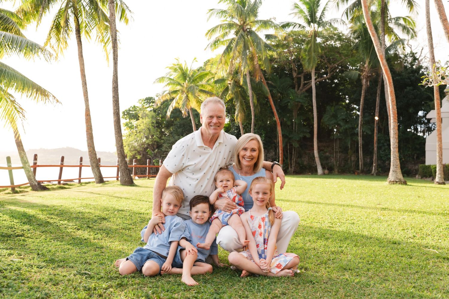 Happy family enjoying a Fiji beach photography session in Fiji with grandparents