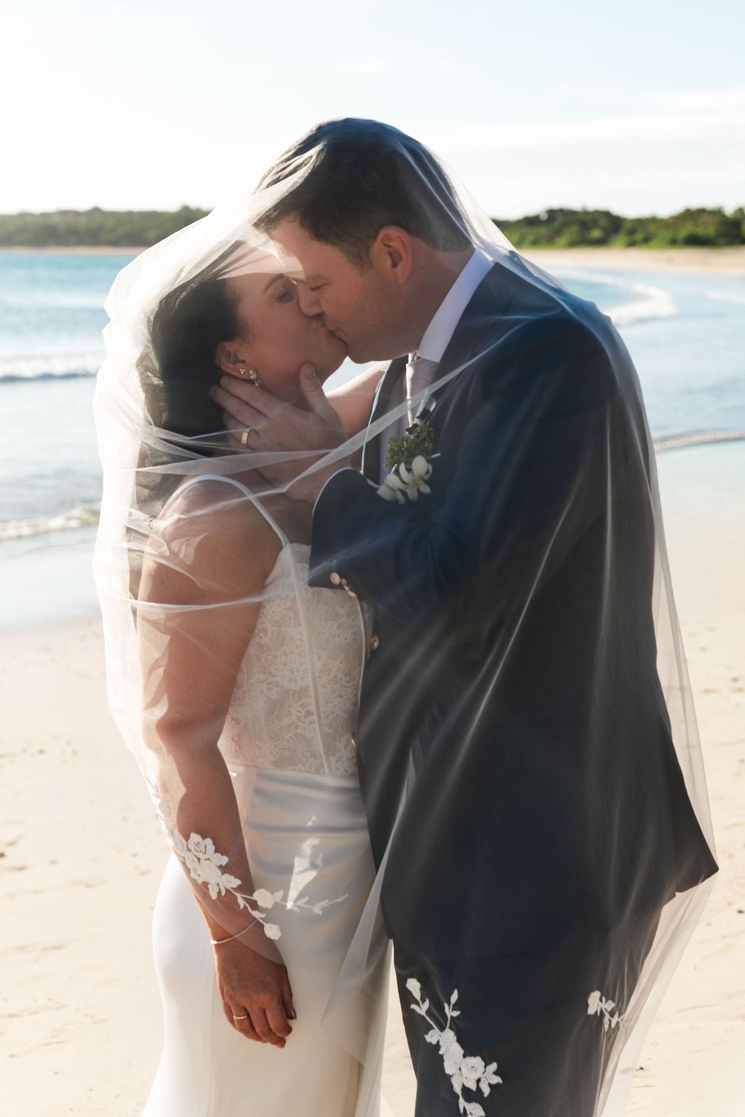 Fiji destination wedding photography capturing a couple celebrating by the ocean