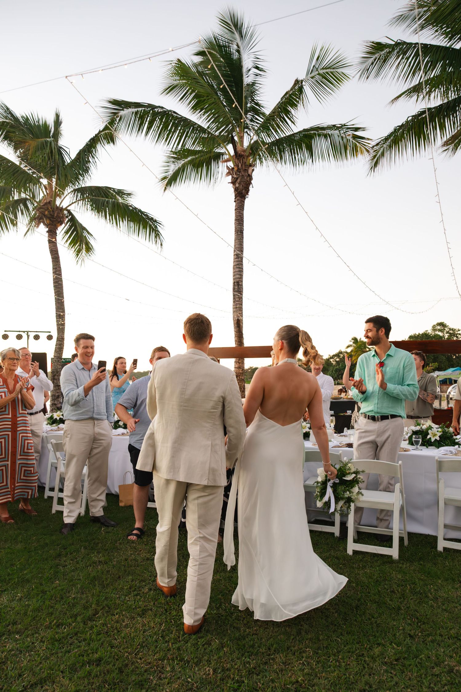 Bride and groom smiling together at their Fiji wedding reception