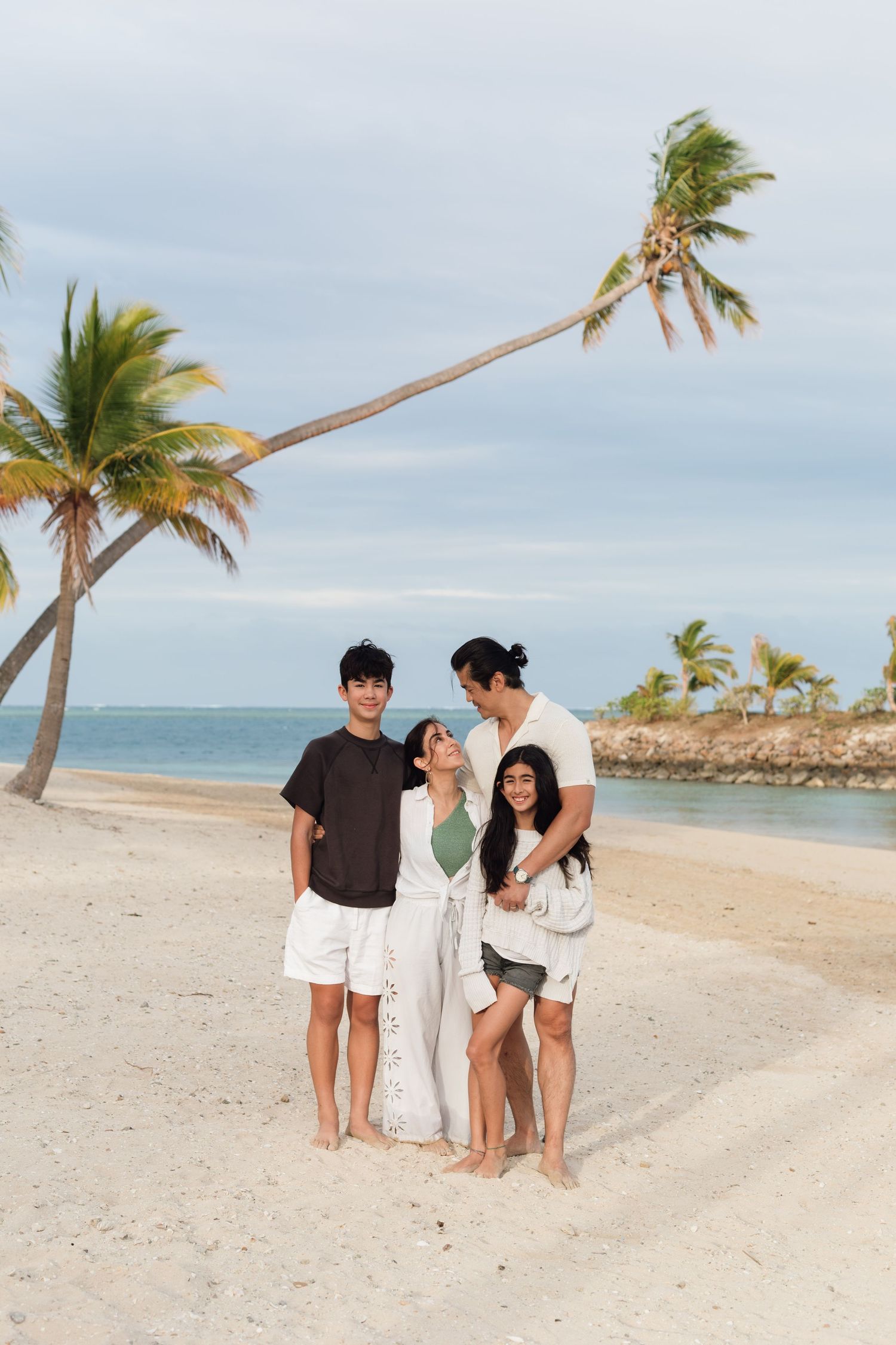 Happy family enjoying a Fiji beach photography session in Fiji on beach