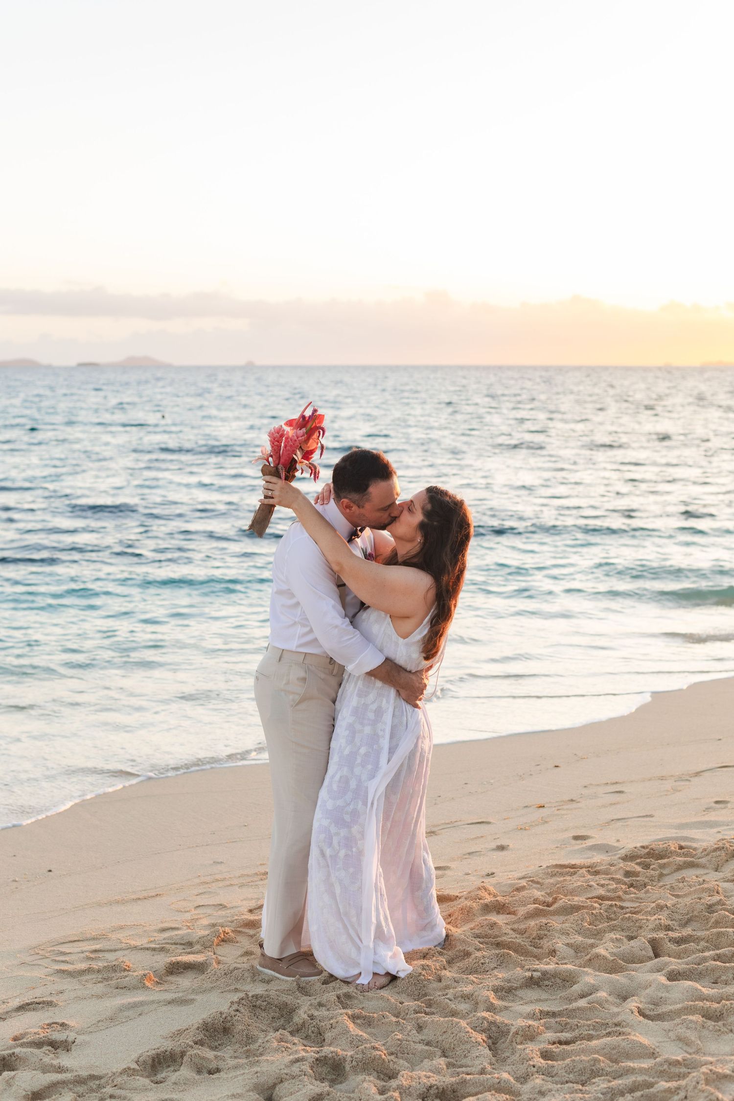 Fiji destination wedding photography capturing a couple celebrating by the ocean