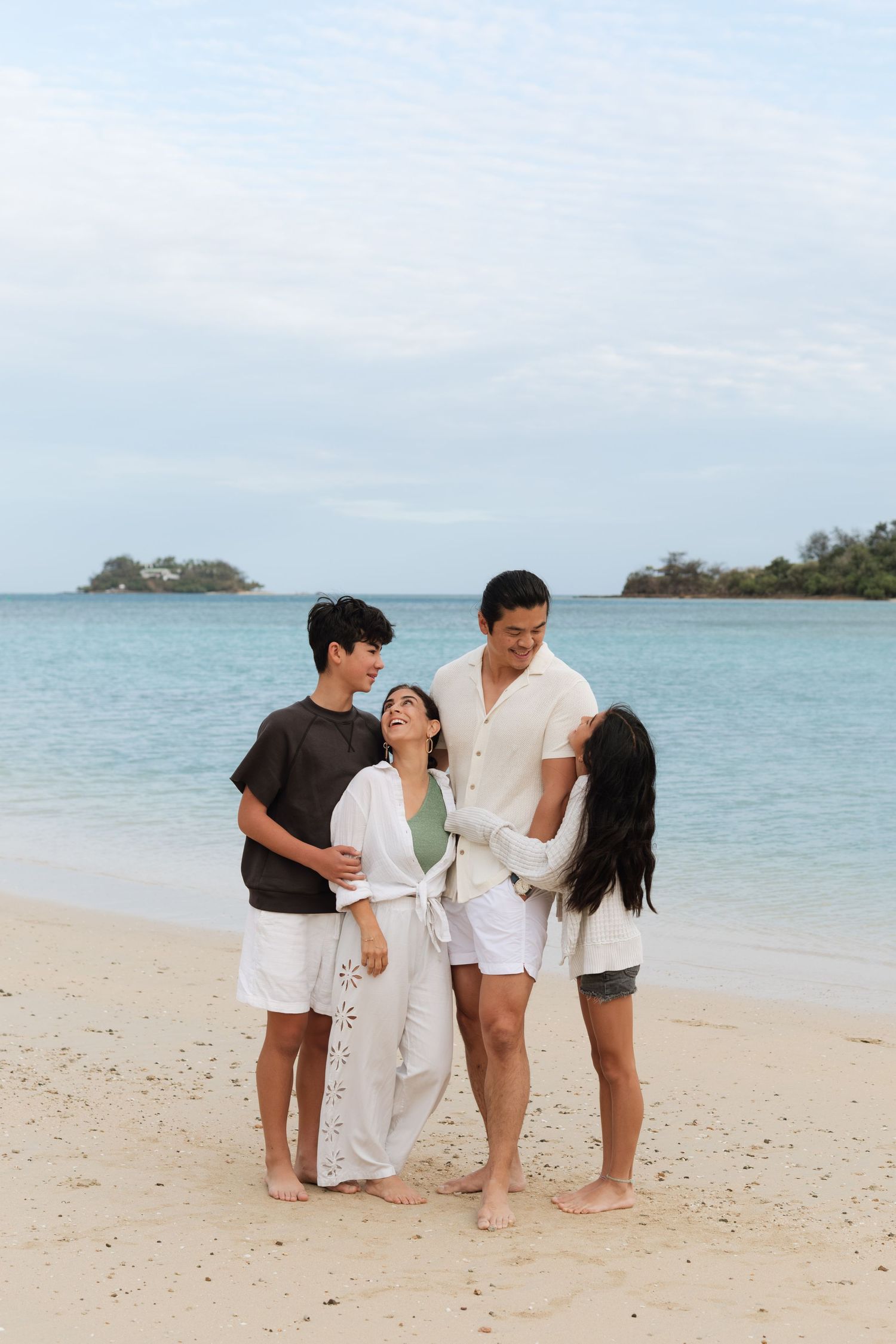 Happy family enjoying a Fiji beach photography session in Fiji on beach