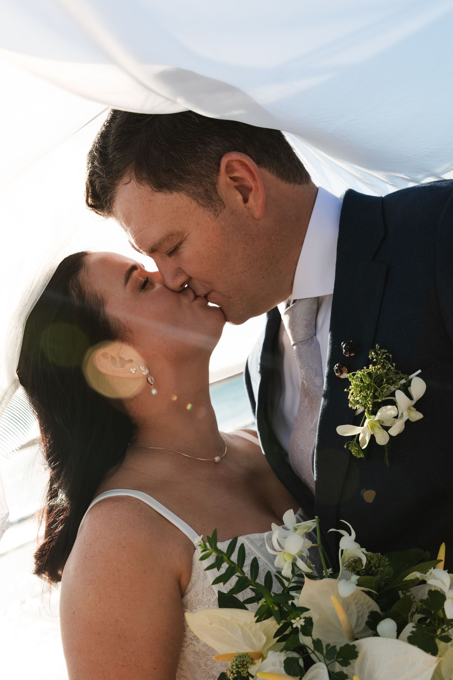 Fiji destination wedding photography capturing a couple celebrating by the ocean