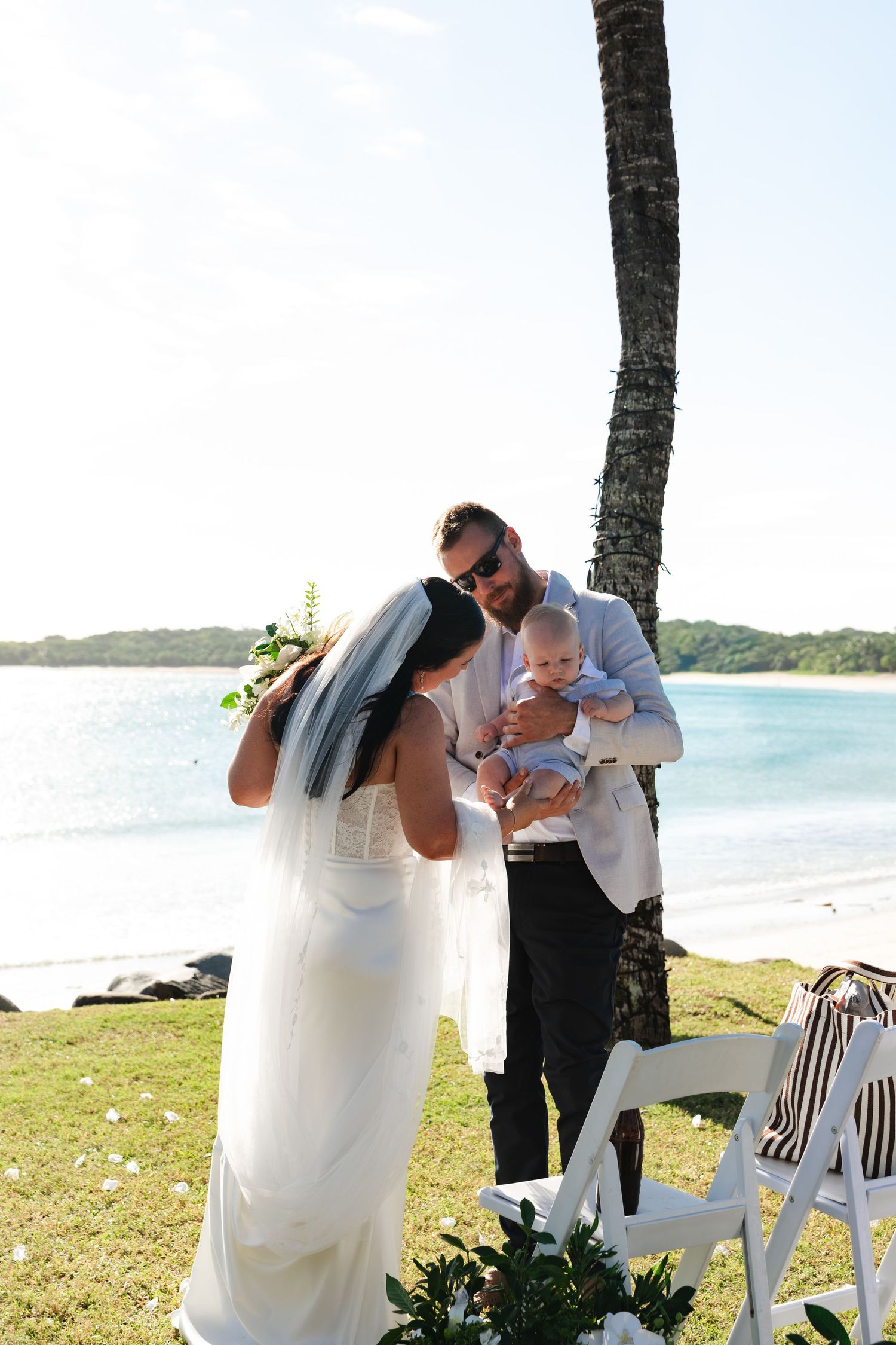 Bride smiling and talking with a wedding guest in Fiji