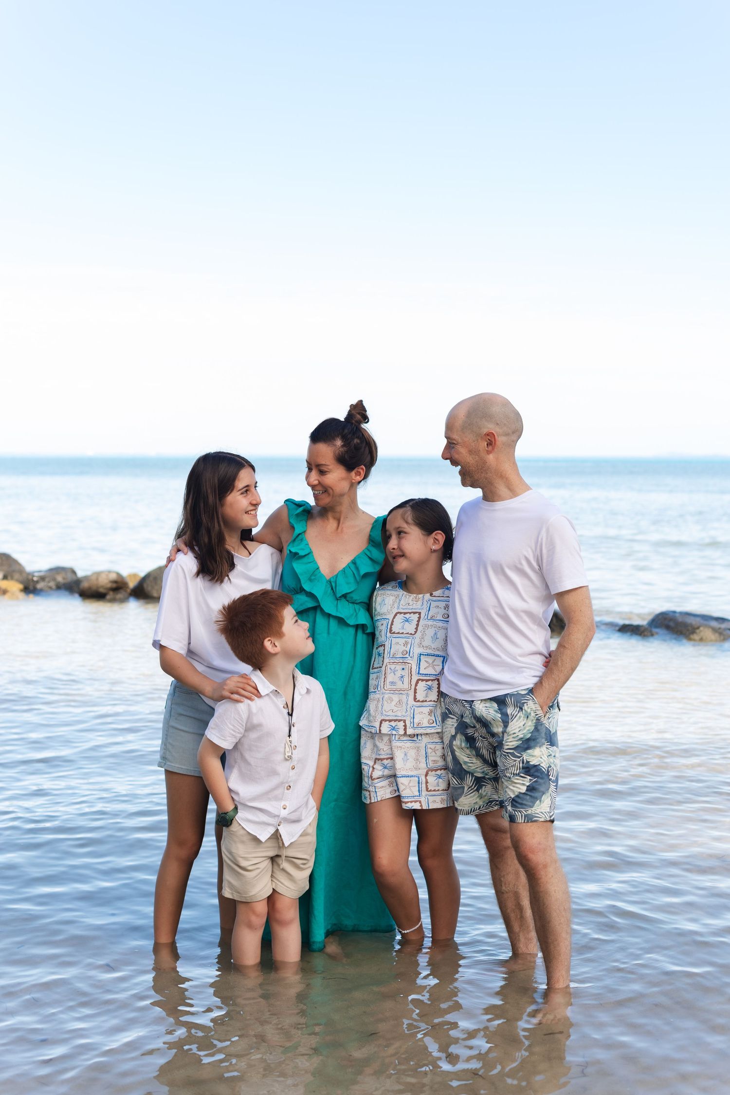 Happy family enjoying a Fiji beach photography session in Fiji on beach