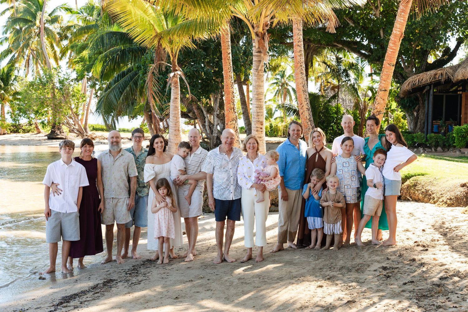 Happy family enjoying a Fiji beach photography session in Fiji. Extended full family photography in fiji