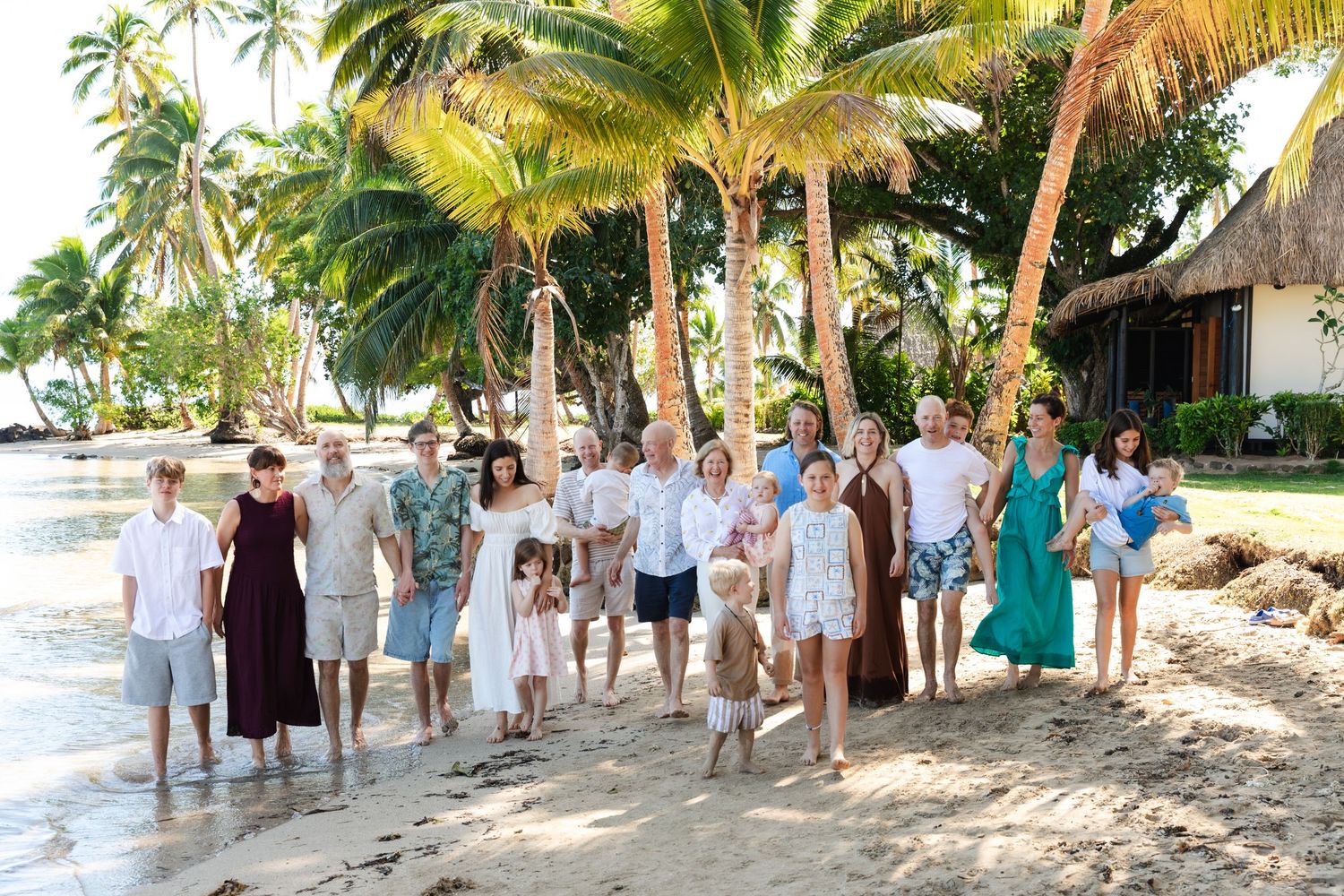 Happy family enjoying a Fiji beach photography session in Fiji. Extended full family photography in fiji