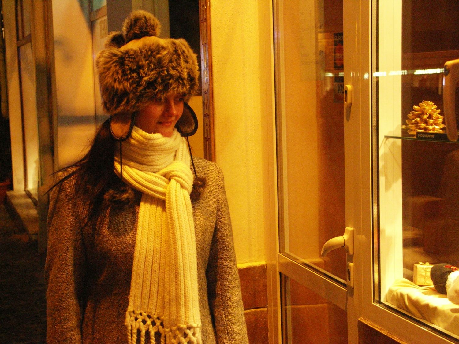 Warmly lit hallway with golden ambient lighting creating a cozy atmosphere.