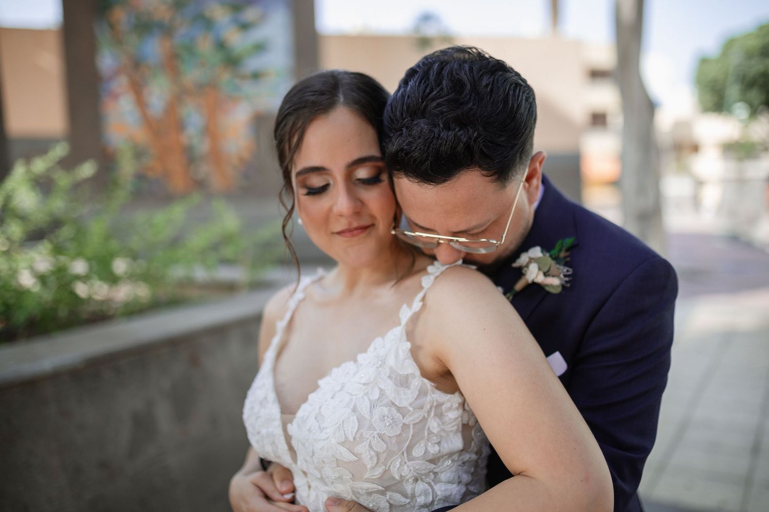 Intimate wedding couple portraits captured in soft natural lighting.