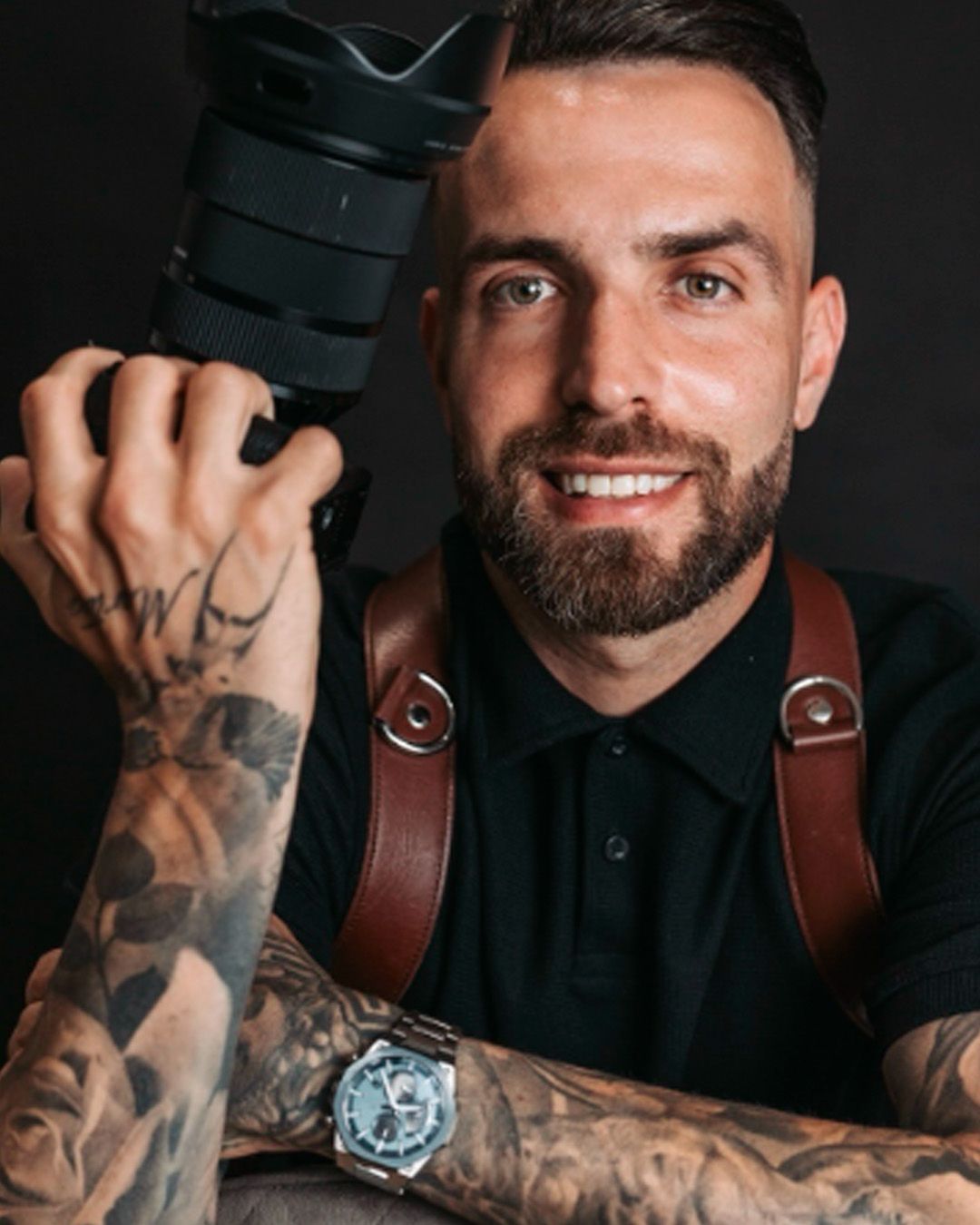 Professional headshot series showing bearded man in black shirt with leather camera strap and tattoos against dark background.