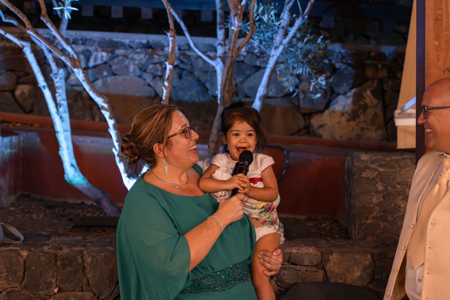 Guests enjoy refreshments at an outdoor evening celebration.