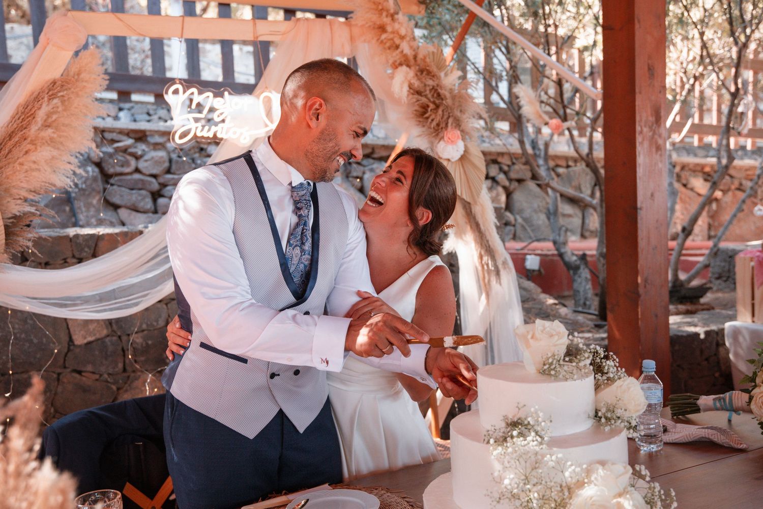Romantic sunset wedding portraits with warm golden hour lighting.