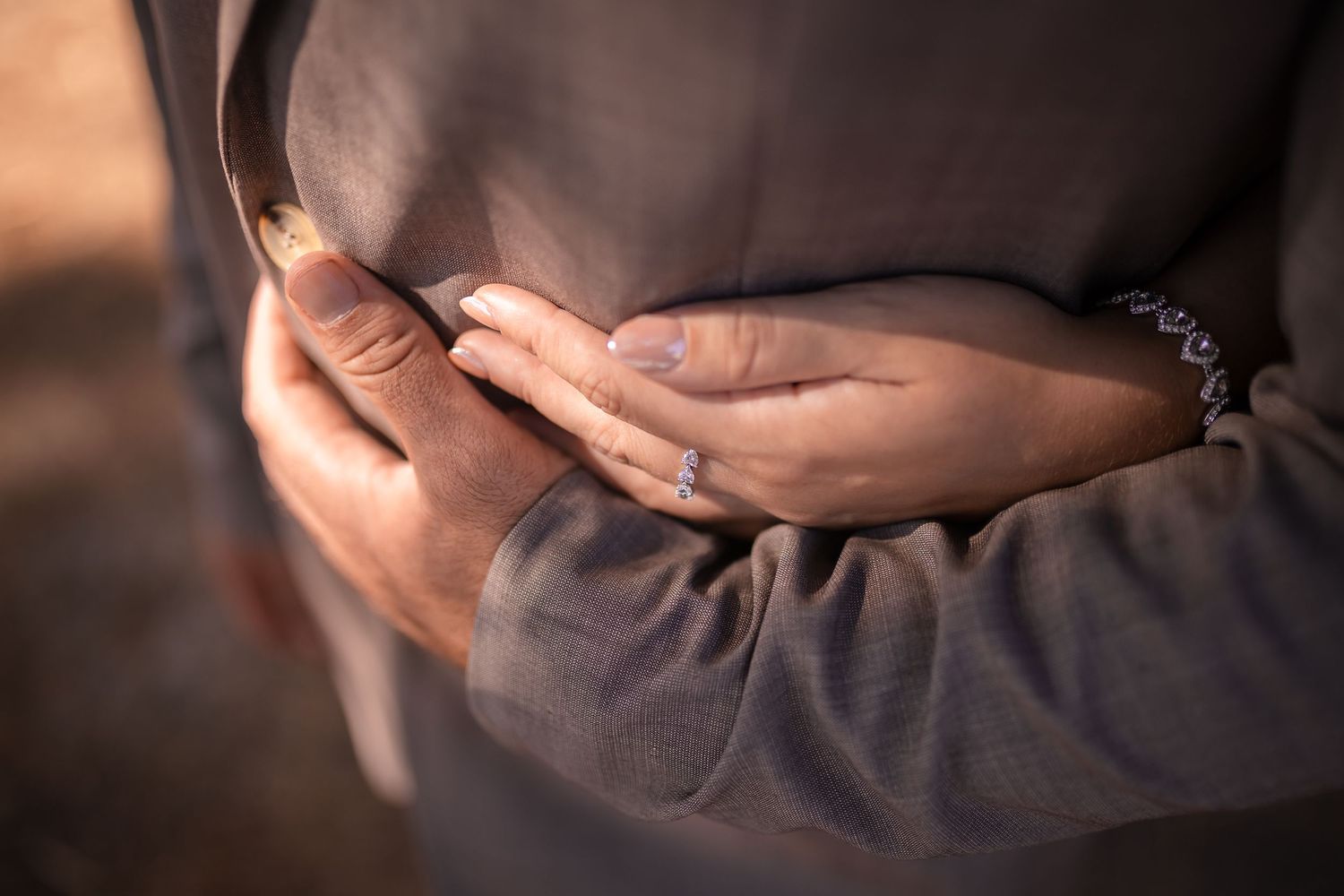 Close-up details of formal attire in warm lighting.