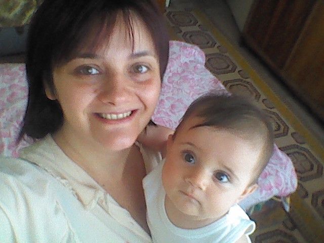 Indoor selfies showing tender moments between adults and a baby.