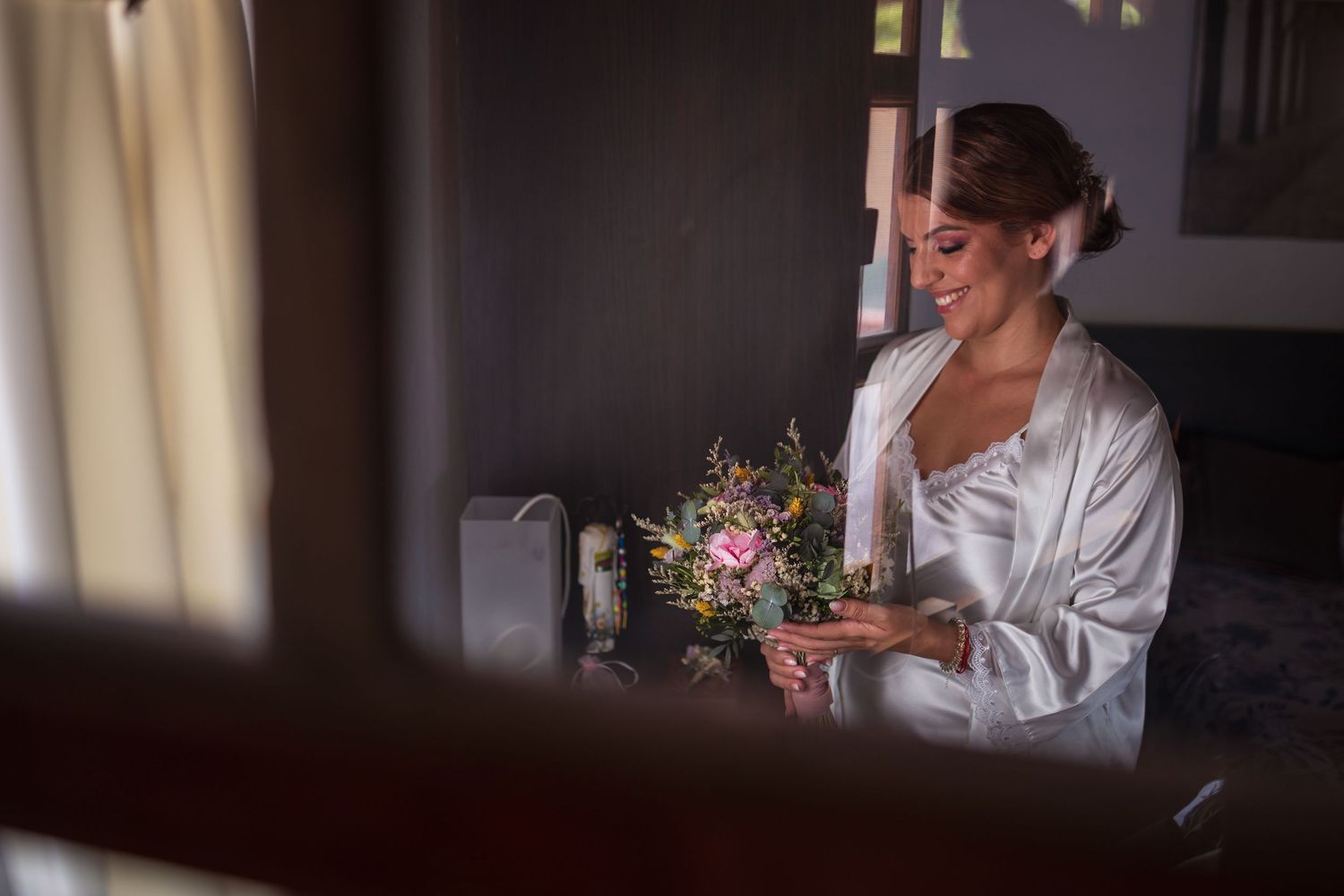 Sunlight streams through windows during wedding day preparations.