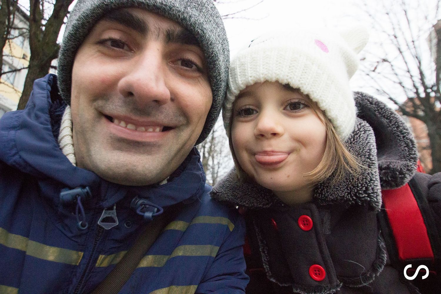 A collection of winter selfies showing people bundled up in knit hats and warm clothing.
