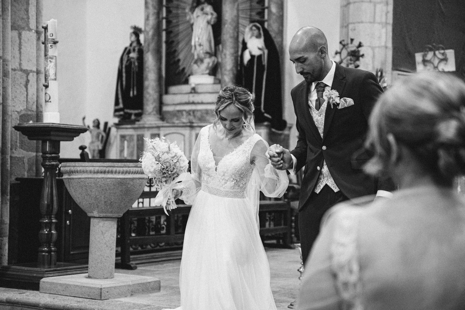 Black and white photos capture elegant church wedding ceremony moments.