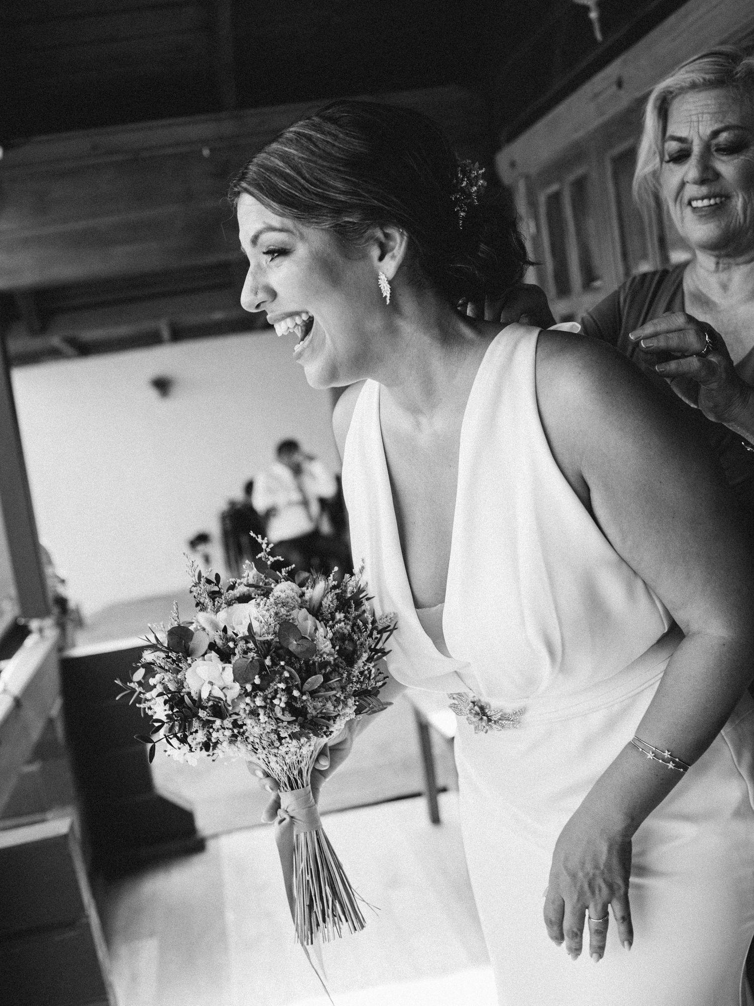 Black and white candid moments captured during wedding preparations.