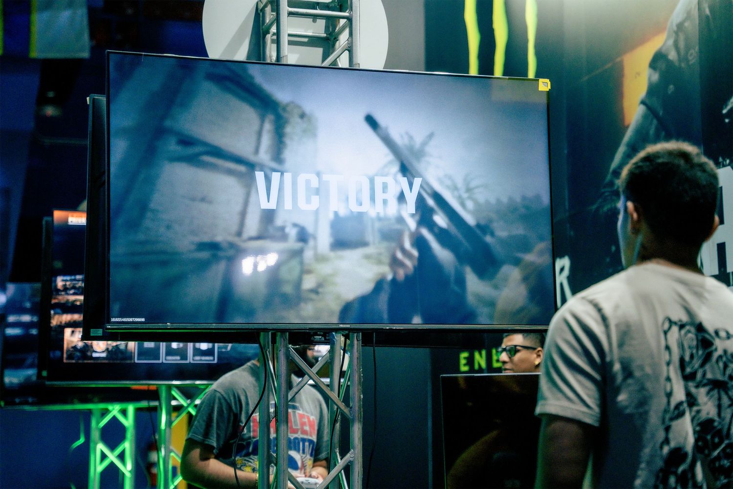 Large gaming displays and stage setup at competitive esports tournament venue.