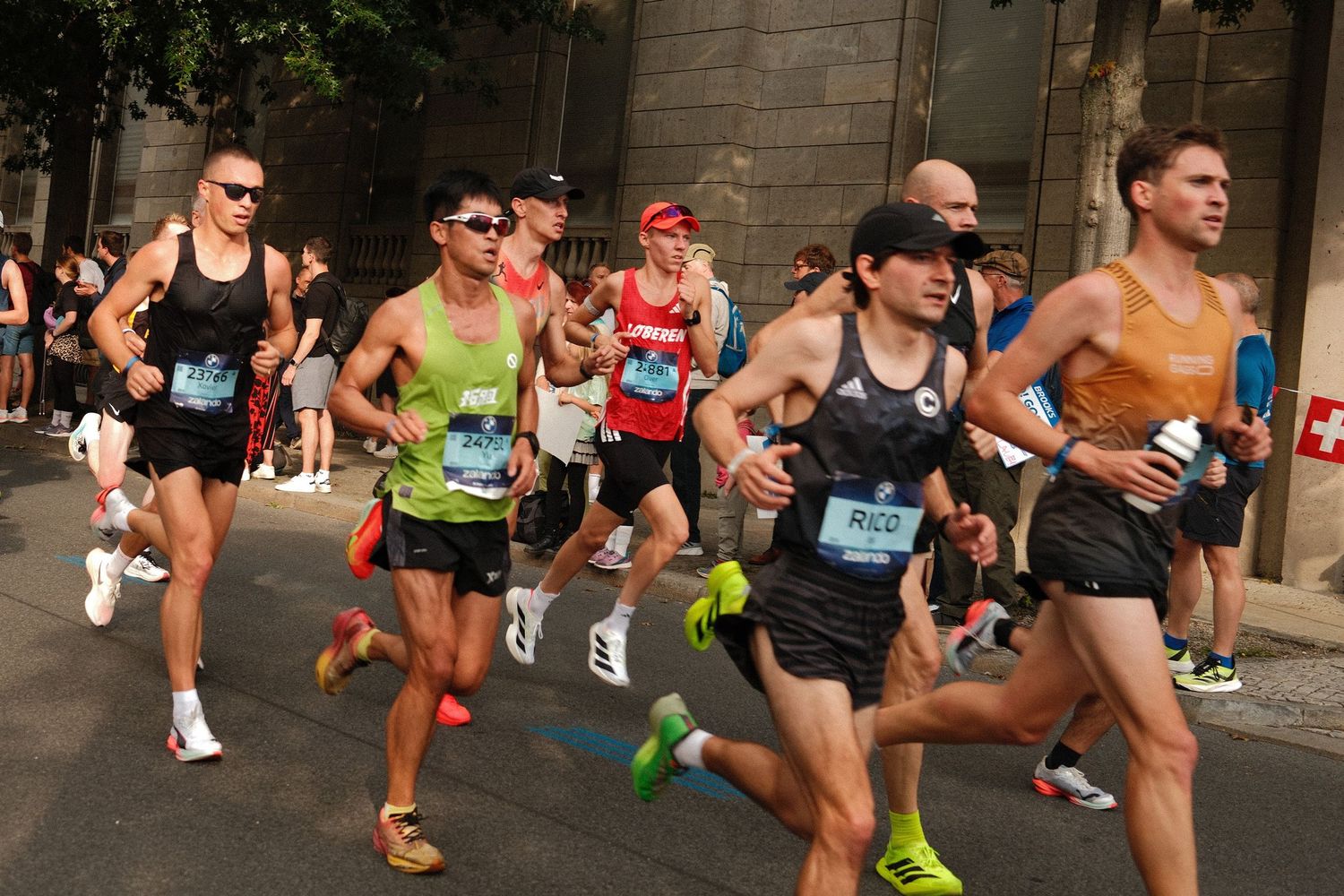 Marathon runners sprint at the start of a competitive race.
