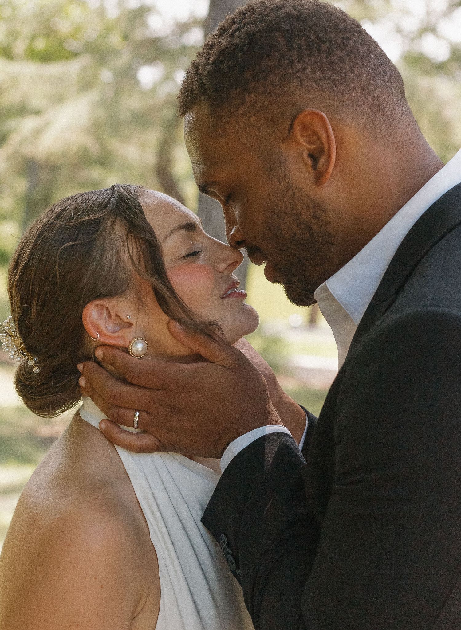 A romantic wedding sequence shows a couple sharing intimate kisses in warm sunlight.
