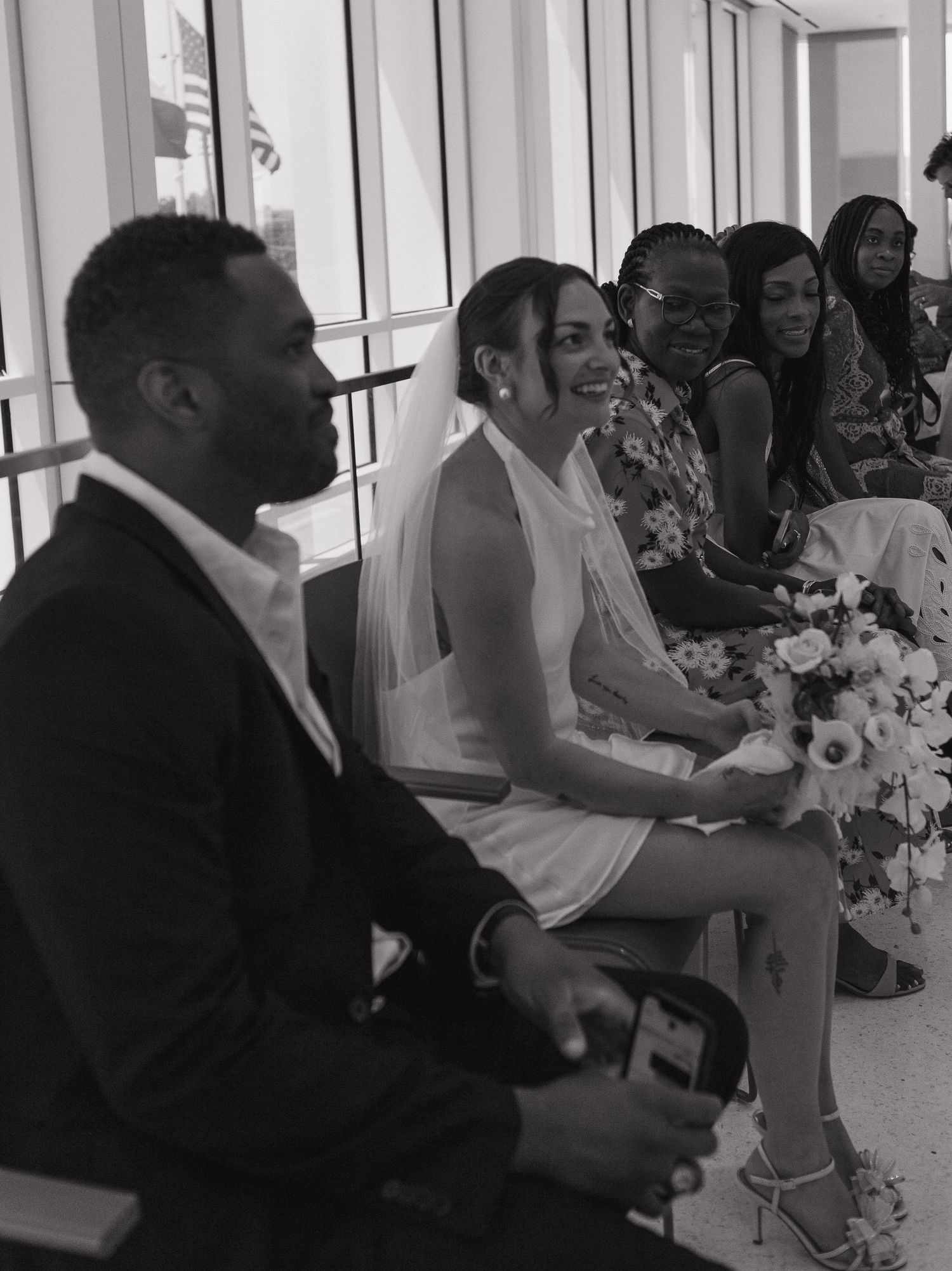 A black and white photo collage shows people gathered at what appears to be a formal event with floral decorations.