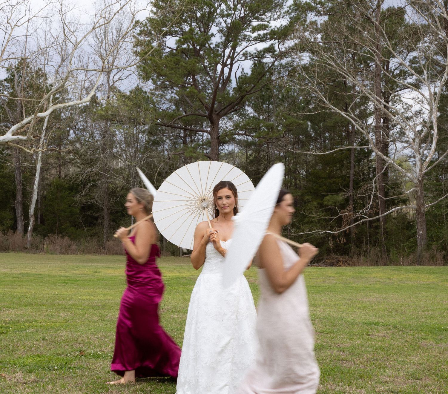 A sequence of four outdoor photos showing someone twirling in a white dress in a grassy field with trees.