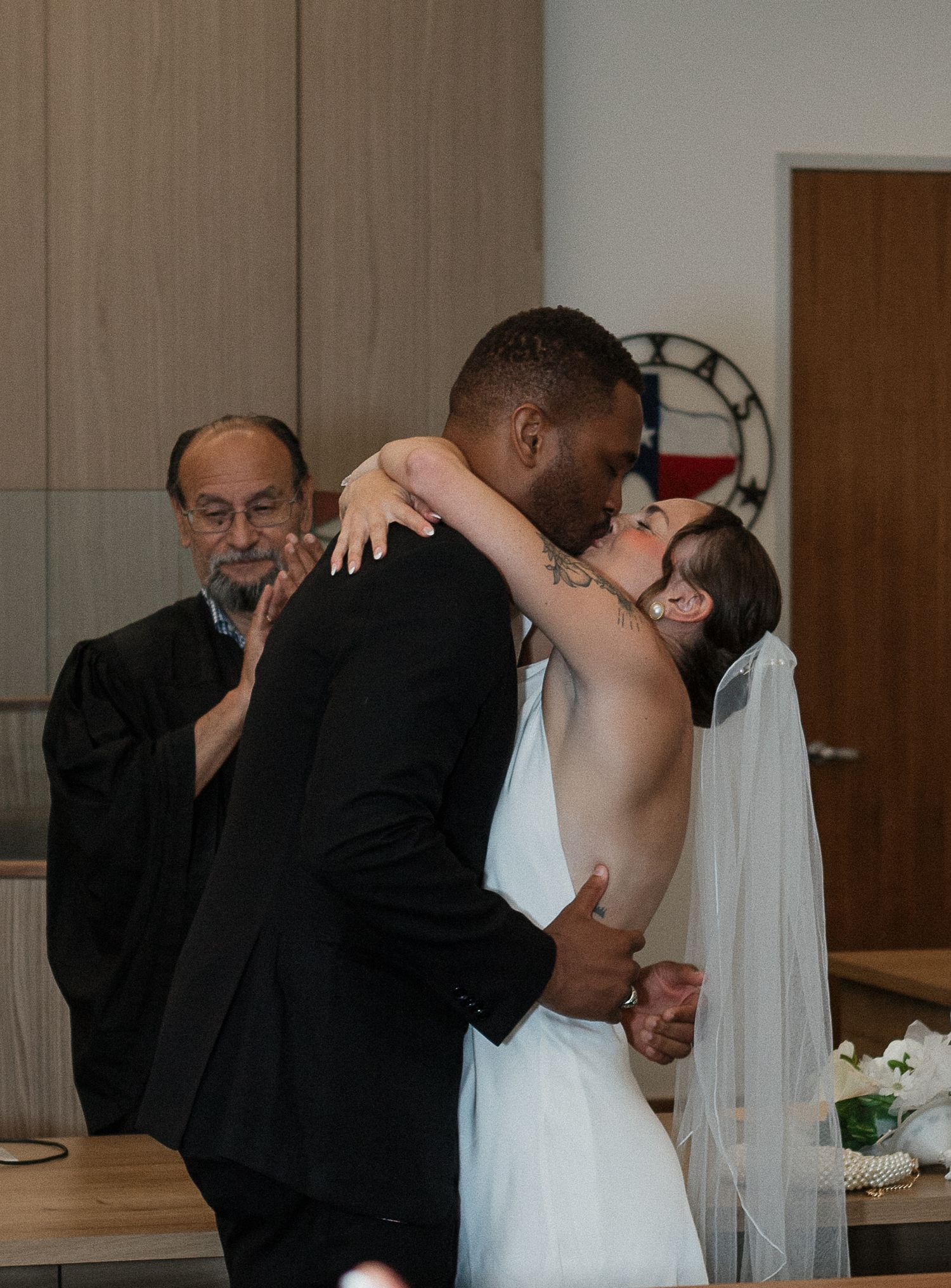 A romantic wedding kiss sequence showing multiple angles of the couple's first kiss at the ceremony.