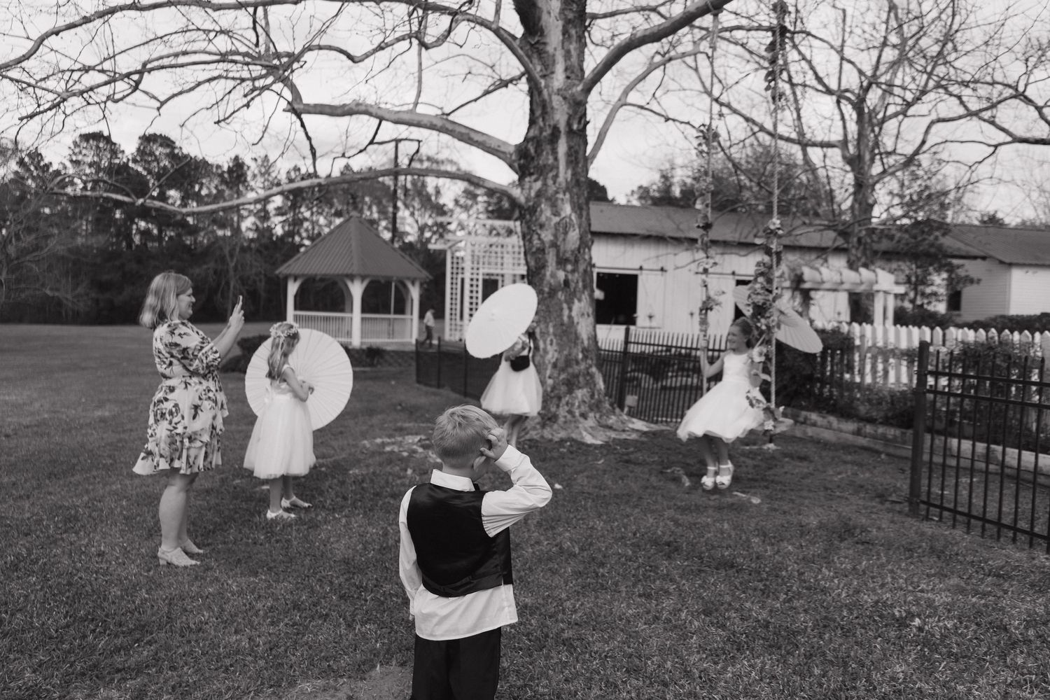 A series of vintage black and white photographs showing people playing outdoors in a park or garden setting.