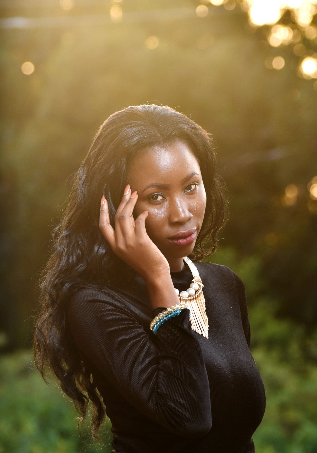 Fashion portrait silhouette against the Nairobi sunset - model's profile outlined by the fiery golden hour sky