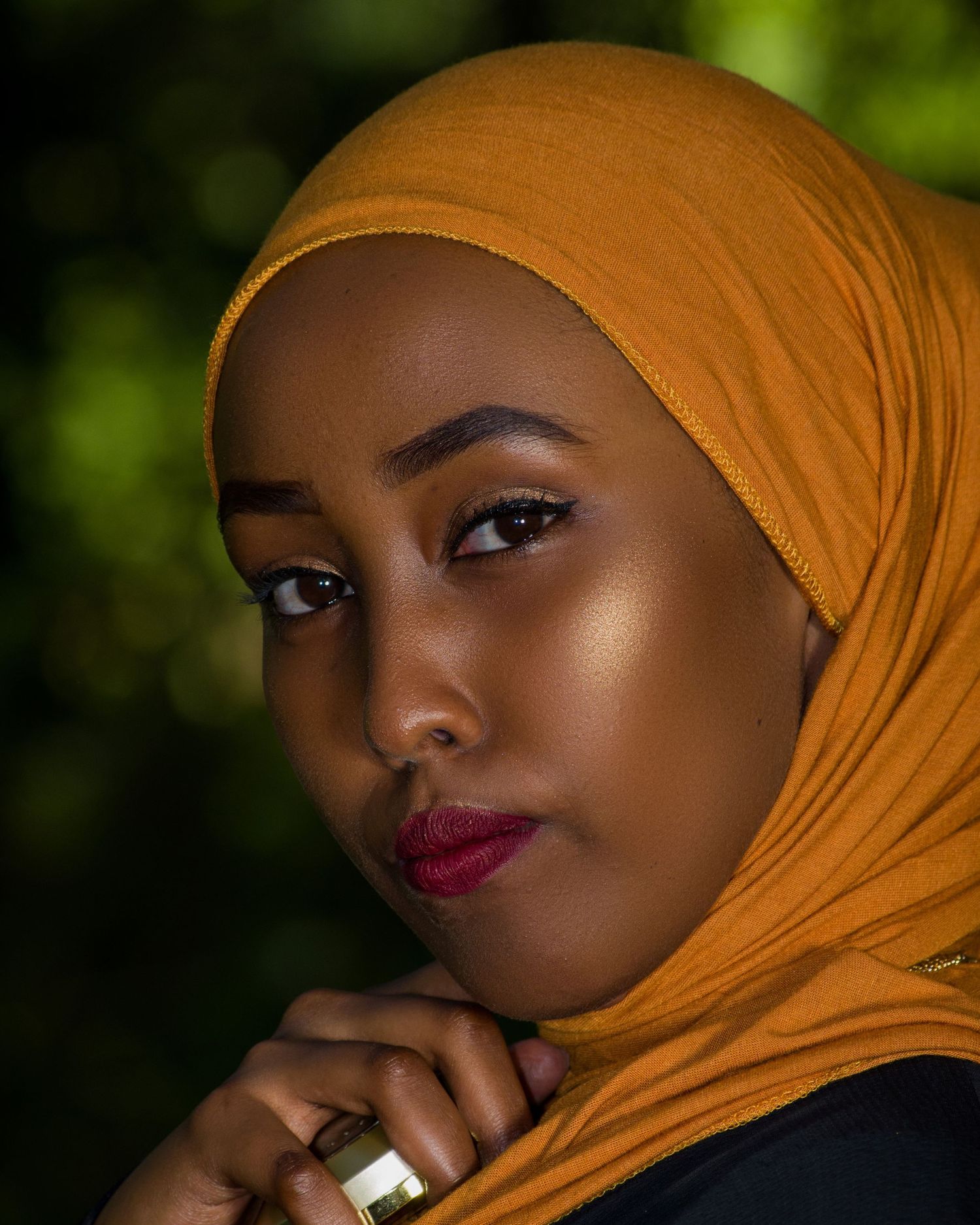 Editorial beauty portrait for a Nairobi makeup artist - showcasing bold, colorful eyeshadow and graphic liner in stunning detail