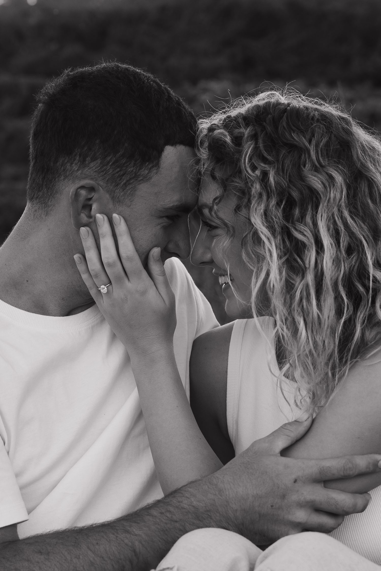 Black and white close-up sequence capturing intimate romantic moments.